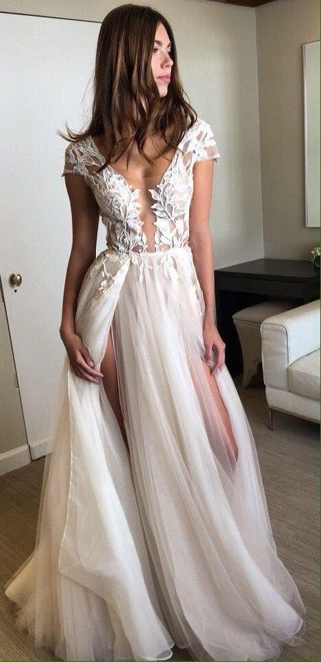 White bridal dress with lace bodice and soft tulle skirt