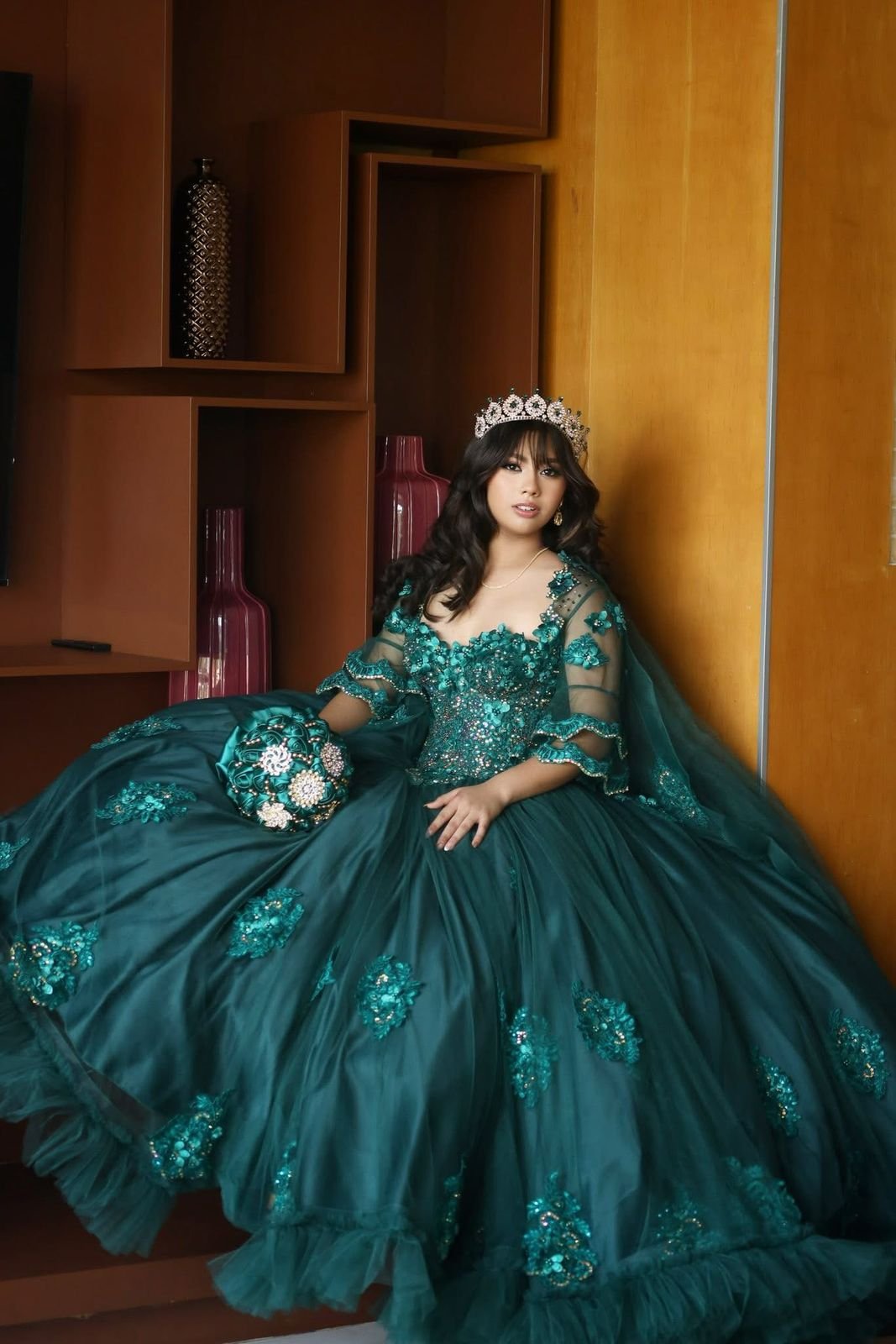 Teal quinceañera gown with embroidered details